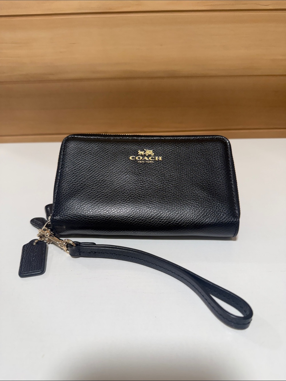 Coach Black Pebbled Leather Wristlet with Gold Logo Accent